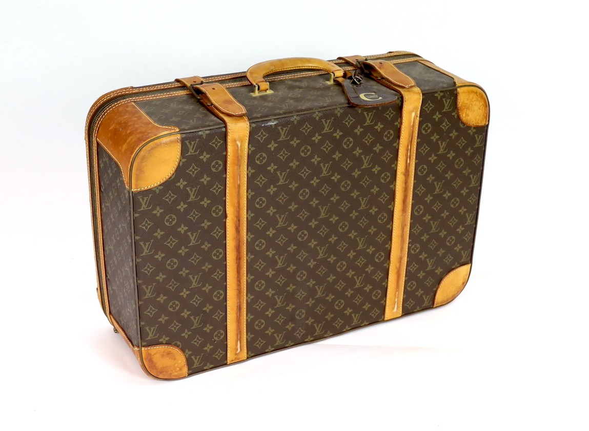 A 1980/90s Louis Vuitton canvas monogram suitcase, 59cm wide, 46cm deep, 23cm high